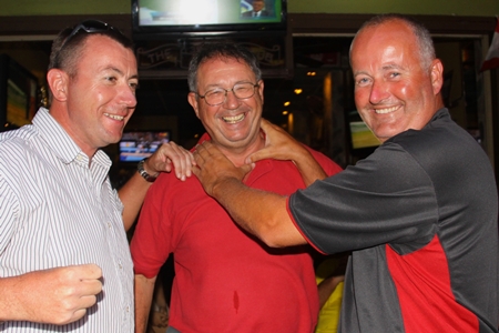 Ian Ashenden and Mark Haffenden congratulate Serge Stratten, centre.